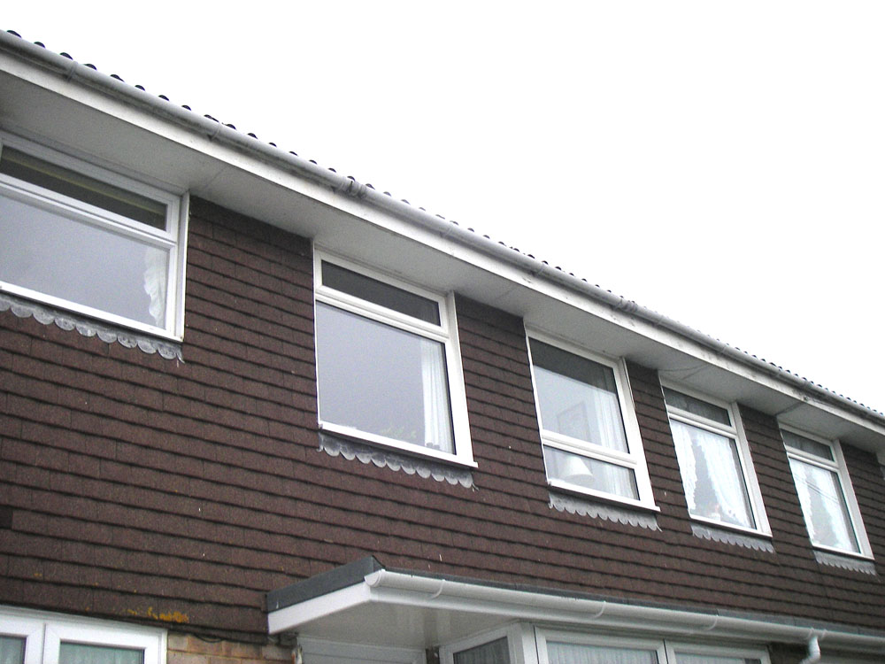 Asbestos insulating board soffits